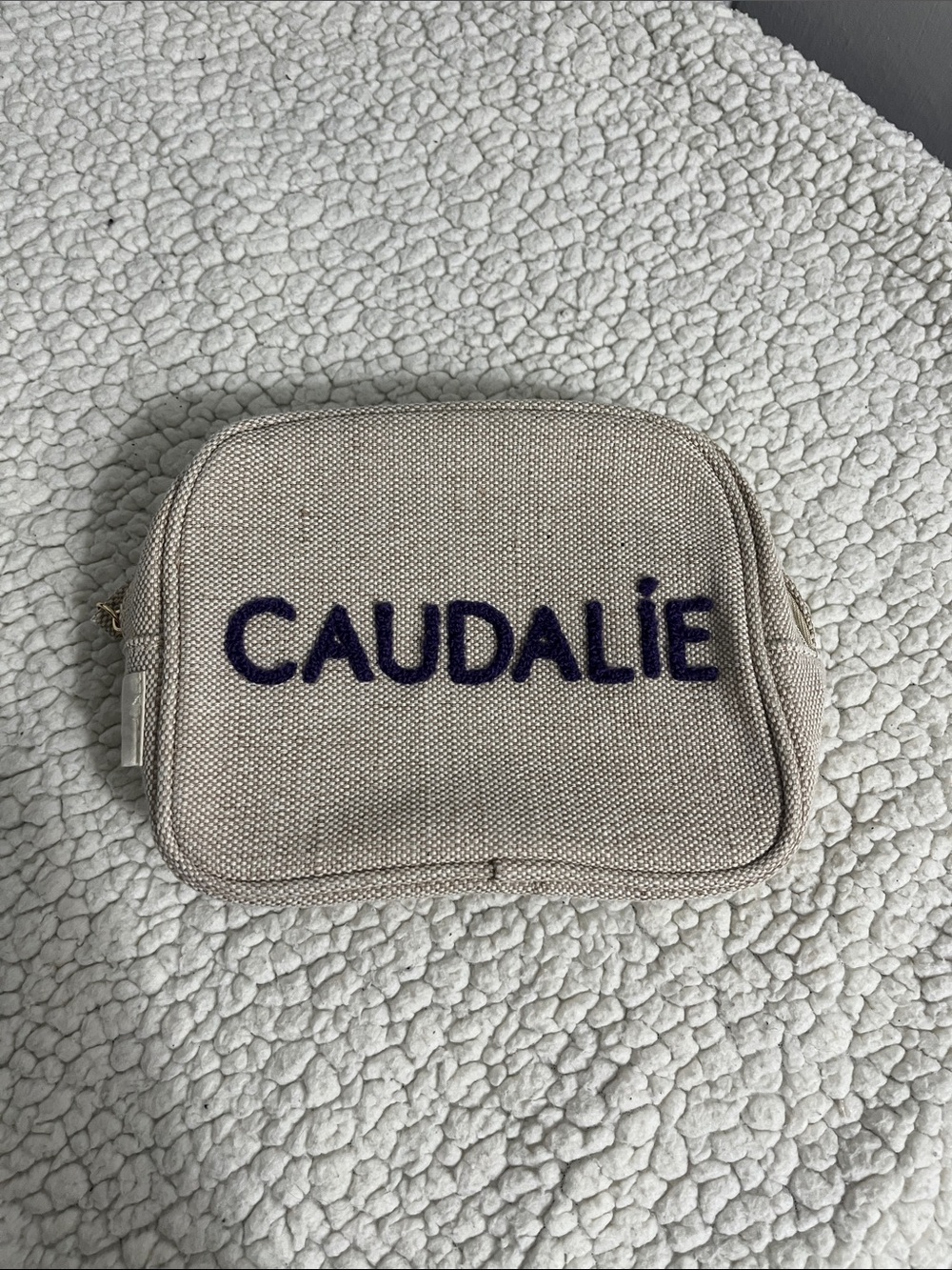 Caudalie Natural Beige Canvas Cosmetic Pouch with Dark Purple Logo
